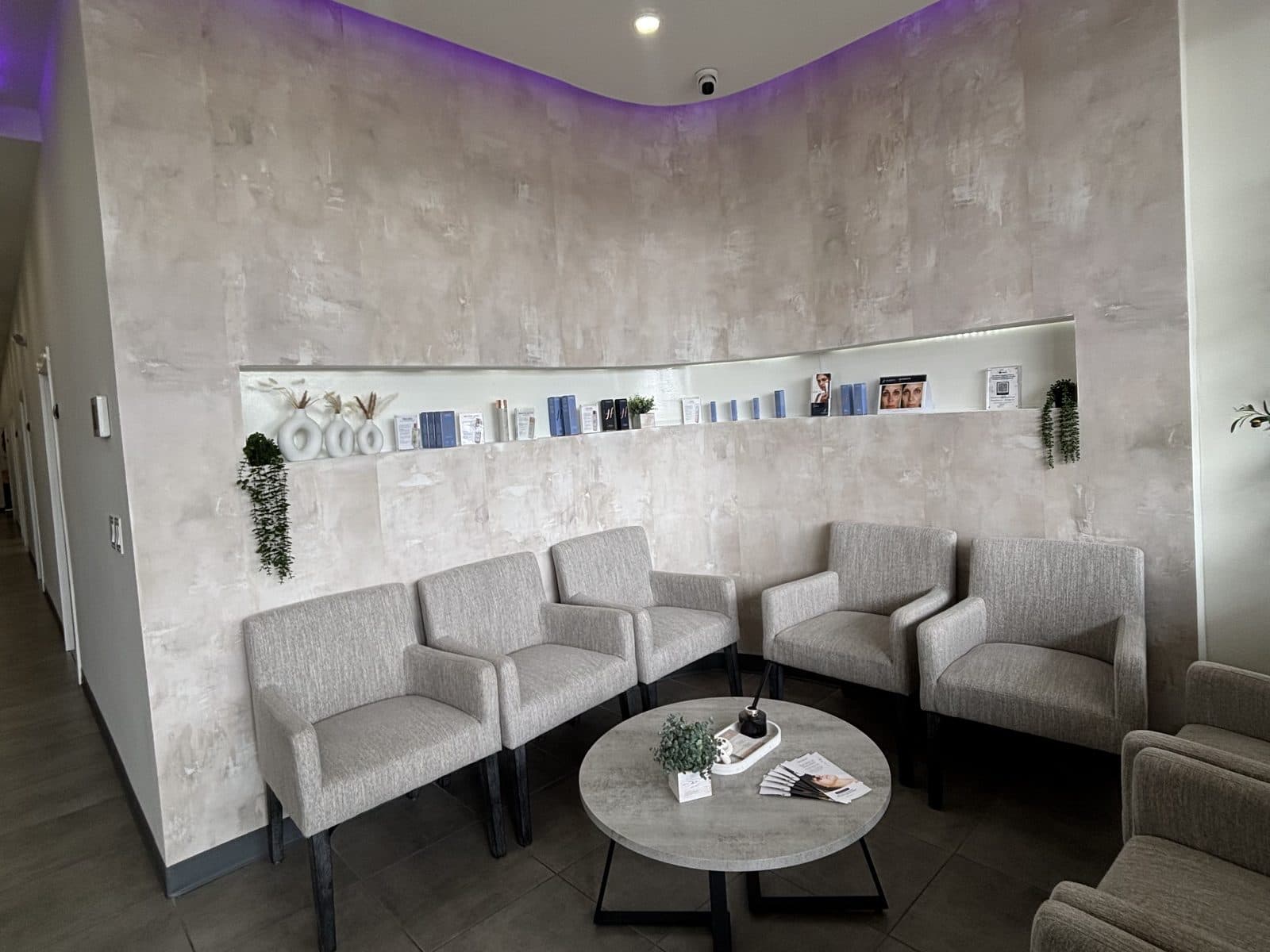 Lounge chairs and the retail wall inside Rewind Bar