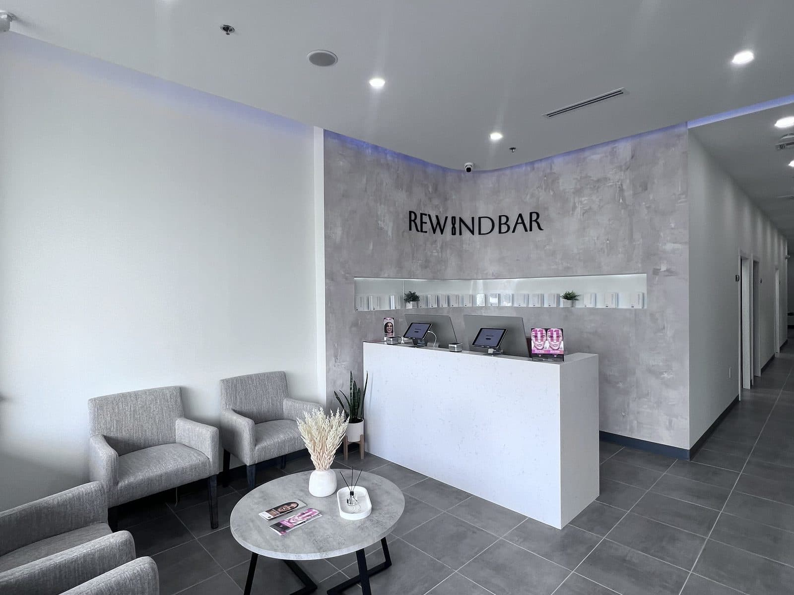 The waiting lounge and reception desk inside Rewind Bar