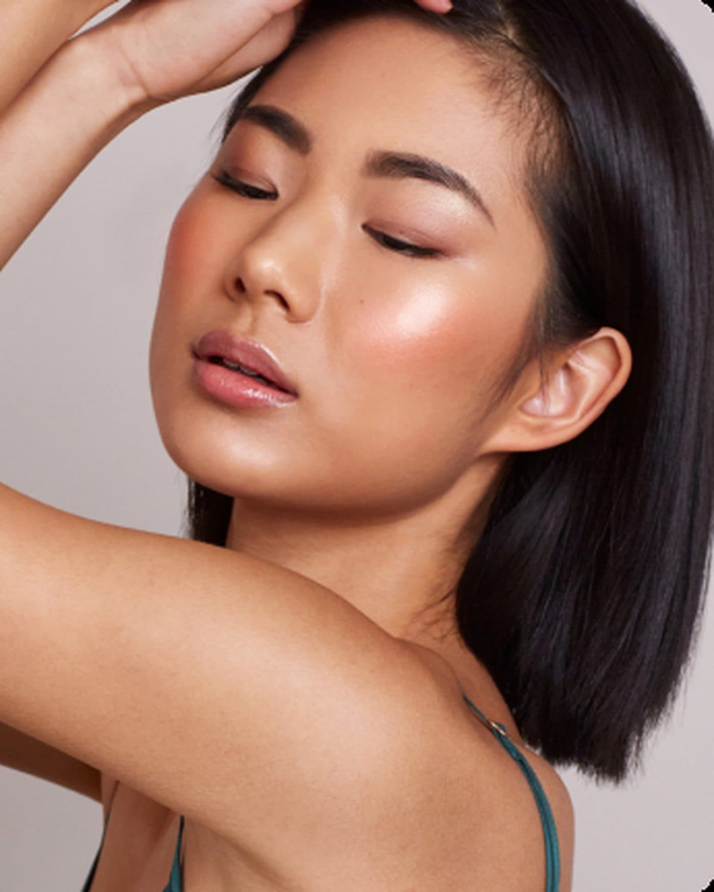 Woman running both hands through her hair